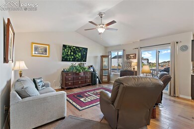 Living Room with wood laminate flooring, walks out