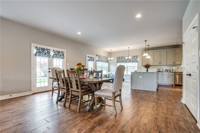 DINING AREA THAT LEADS OUT TO THE PATIO AREA WITH 