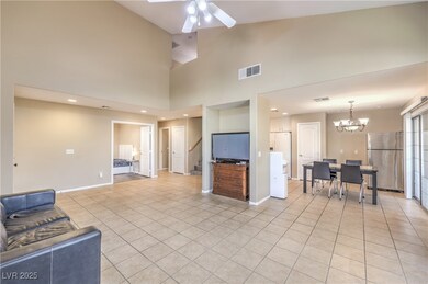 Living area with stairway, vaulted ceiling, light