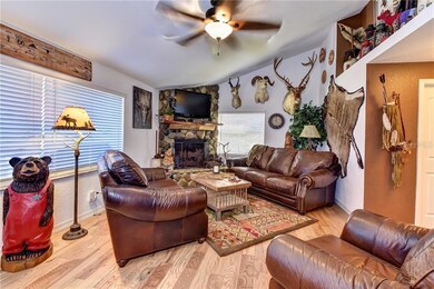 Upstairs living room with wood burning fireplace a