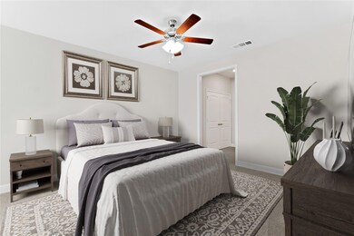 The primary bedroom is incredibly spacious and fea