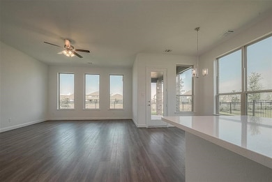 An expansive open-concept living and dining area w