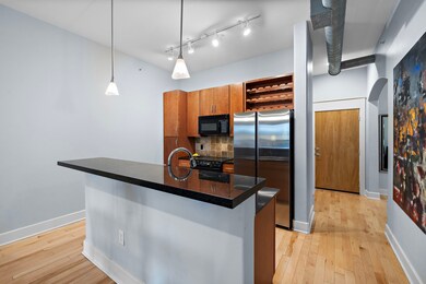 Featuring a sleek open kitchen layout, this photo
