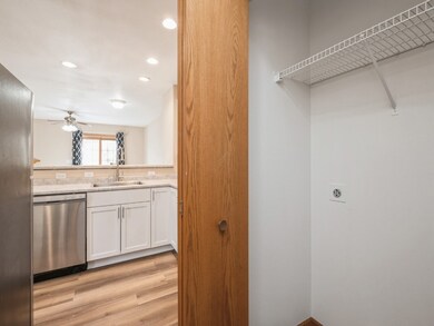 Garage entrance with coat closets at front and gar