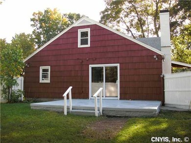Exterior Back. Concrete patio leads to the enclose
