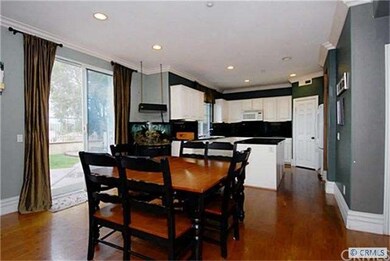Breakfast nook and kitchen with slider to backyard
