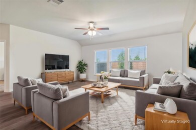 This oversized family room is ready for movie nights, family get togethers and parties! Digitally staged photo.