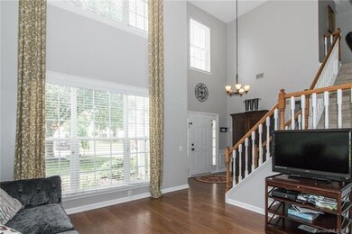 Large windows at the front of the home flood the f