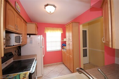Kitchen features built-in pantry and bar area