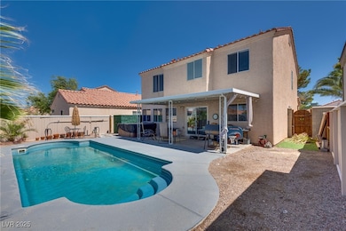 View of swimming pool featuring a patio, a fenced