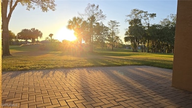 View of property's community featuring a yard and