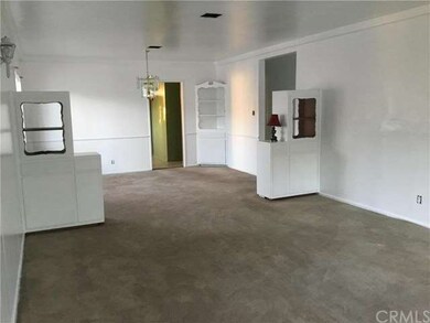 Living Room view connecting to Dining Area with en