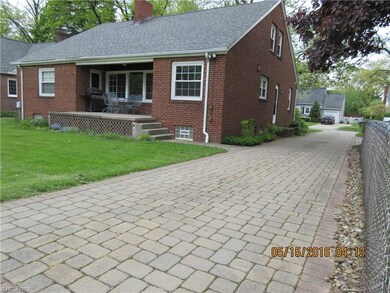 Back corner of home showing paverstone drive.