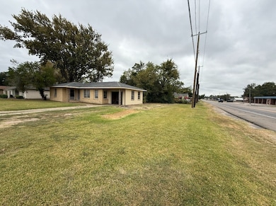 Ranch-style home featuring a front yard