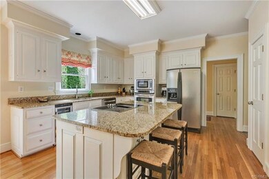 Breakfast bar, stainless appliances and TWO pantri
