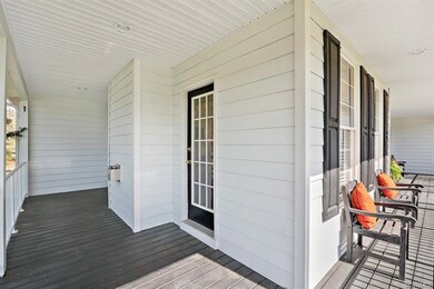 Front full country porch with access to the living