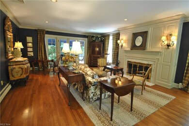This large living room features hardwood floors, c