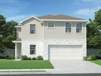 View of front of house with stone siding, drivewa