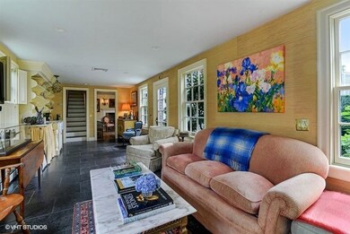 Another view of the family room showing a sink on