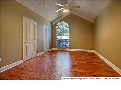 Large Mater Bedroom with Wood Flooring. Large Walk