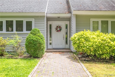 Property entrance with a shingled roof