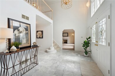 Step into the grand entryway of this exquisite hom