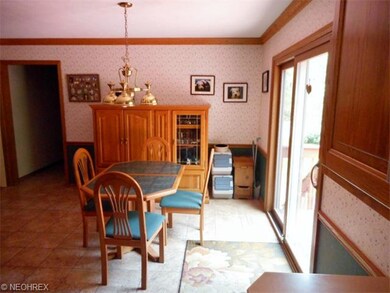 The eating area of the kitchen leads to the slider