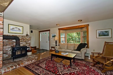 Living room with woodstove and hearth