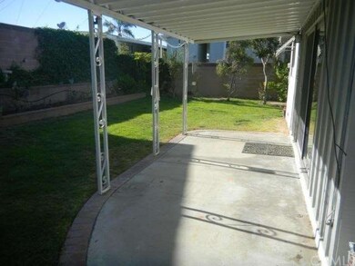 Covered patio, spacious yard with automatic sprink