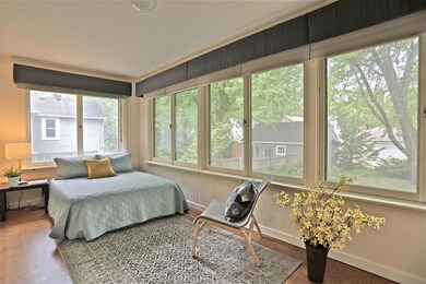 Bedroom # 2, formerly used as an office, has large windows with beautiful backyard views