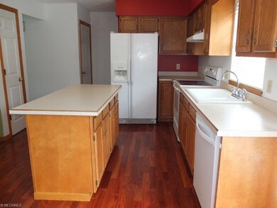 Fully applianced kitchen with pantry.