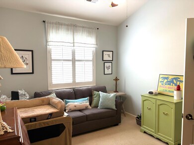 Living room with light carpet, vaulted ceiling, vi