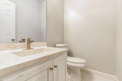 Bathroom featuring vanity and tile patterned floo