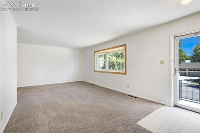 Empty room with light colored carpet