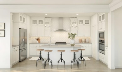 Kitchen with pendant lighting and glass upper cabinets