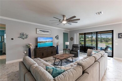 Living area with baseboards, ornamental molding, c