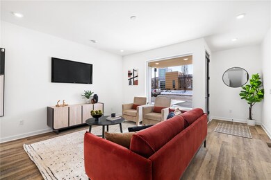 Living room *Photo of model home at 21 Rose