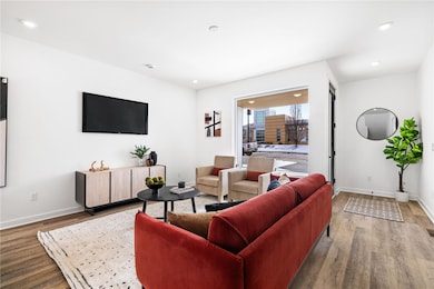 Living room *Photo of model home at 21 Rose