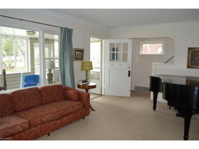 Large living room features crown molding