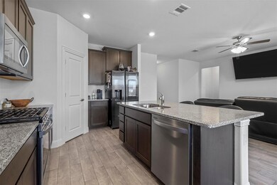 Kitchen with light hardwood / wood-style flooring,
