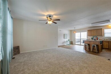 Spacious, open living area with brand NEW carpet!