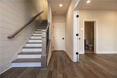 Step into a welcoming foyer with soaring ceilings 