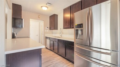 Sleek kitchen features new Quartz counters, new ca