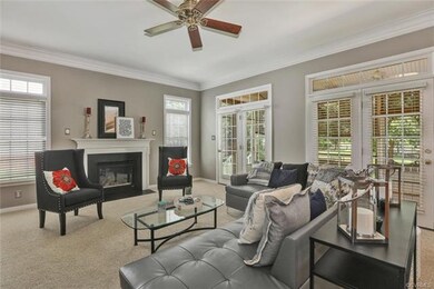 Drop down family room with new carpet, fresh paint