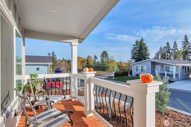 Bathed in natural light, offering territorial views and plenty of fall color to enjoy! A great front porch for a cup of coffee or reading a book.