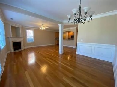 Unfurnished living room with a fireplace, crown mo