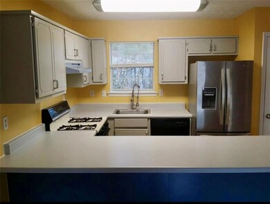 Kitchen with stainless steel fridge, under cabinet