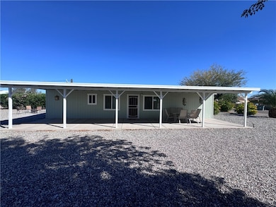 Rear view of property with a patio