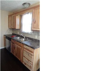 New kitchen with knotty alder cabinets and stainle