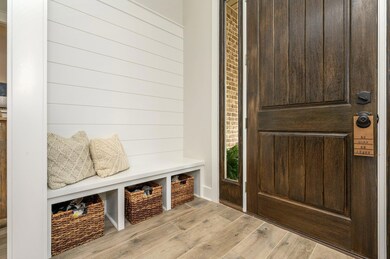Foyer with built in mud bench